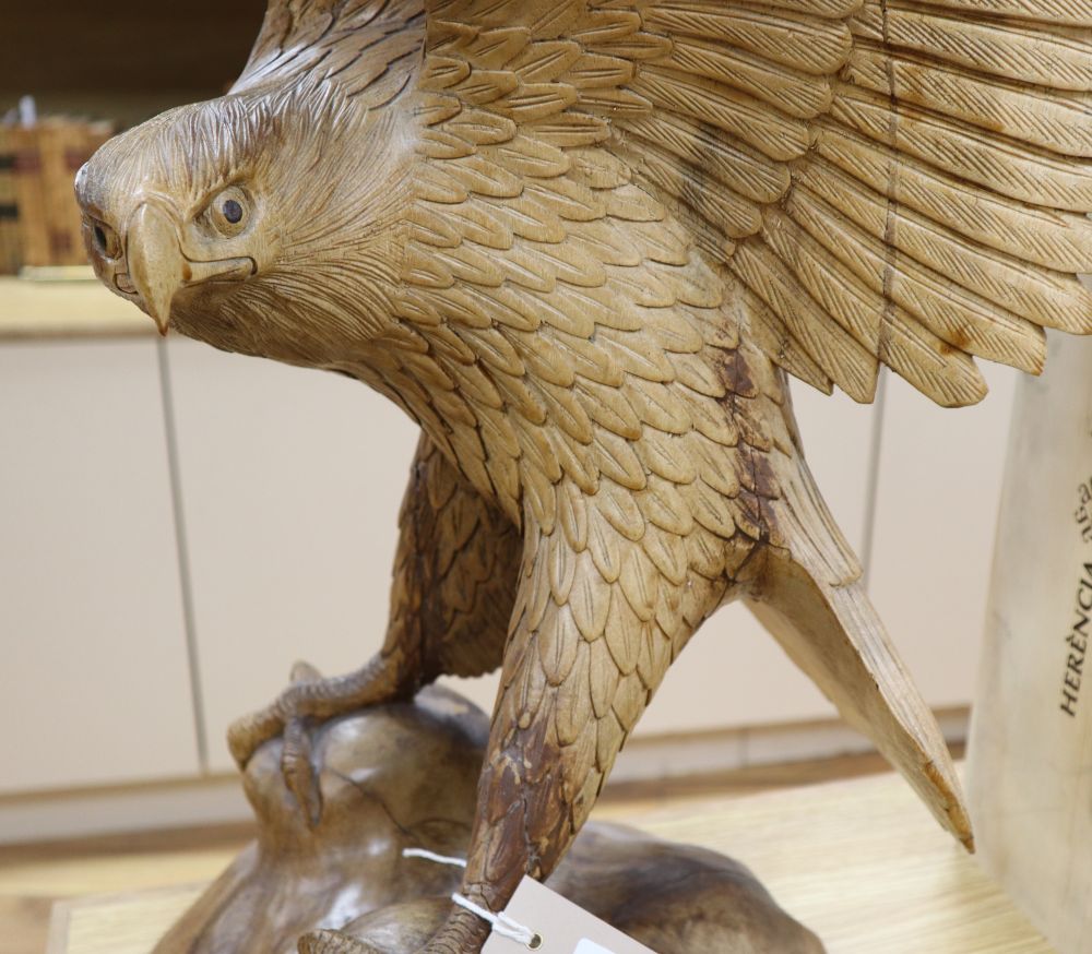 A contemporary carved wood model of a Golden Eagle